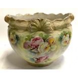 A large glazed ceramic planter with floral decoration, 42.5cmD