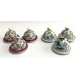 A set of six Limoges porcelain lidded butter dishes, three decorated by Laure Selignac with pink