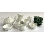 A 21 piece Coalport countryware white cabbage ware tea set; together with six green cabbage ware
