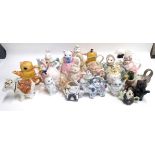 A collection of 22 novelty teapots in the form of various animals including cats, ducks, rabbits,