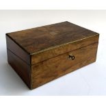 A Victorian rosewood writing box with key, vacant brass plaque, brass bound, the interior complete
