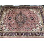 A pink ground wool rug, 275x191cm