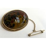 A 9ct gold and moss agate brooch, with safety chain, 4cmW, approx. 15.2g