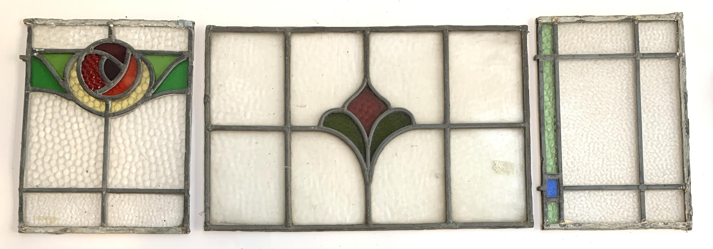 Three leaded stained glass panels, the largest 29x45cm