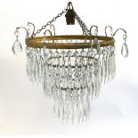 A three tier gilt metal chandelier with cut glass droplets, approx. 26cmH, together with 2 gilt