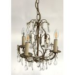 A four arm chandelier with cut glass drops and flower decoration, approx. 35cmH