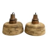 A pair of contemporary turned hardwood hanging light shades, brushed copper effect fittings, 40cmD