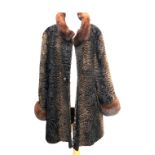 A lambswool ladies overcoat, with fur collar and cuffs, size 12