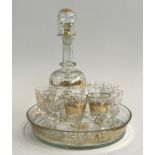 A Bohemian glass gilt schnapps decanter set, comprising decanter, seven stemmed glasses, and