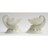 A pair of Royal Worcester blanc de chine salts in the form of dolphins, marked to base 6/92, each