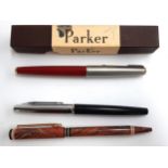 A boxed red Parker 61 fountain pen, together with a marbled Waterman's pen (shell of pen only) and