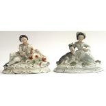 A pair of 19th century Staffordshire figurines in the form of a continental gentleman and lady,