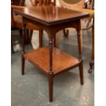 A mahogany occasional table with moulded foldover swivel top, on splayed turned legs and undershelf,