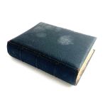 A small Victorian photo album with photographs