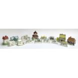 A lot of fifteen small Coalport ceramic cottages to include Summer Retreat, Rustic Cottage, Tudor