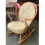 An Ercol beech hoop back rocking chair, 76cmW