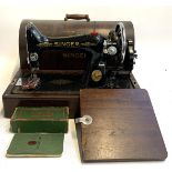 A Singer Sewing machine with accessories, model number ed947261