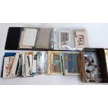 A collection of postcards and WW1 silks in an album and tin, themes including aircraft, Paris,