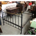 An iron and brass bed, with later wooden slats and mattress, the headboard 142cmH