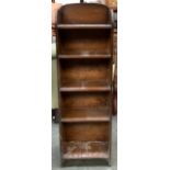 An oak bookshelf, bears label for V.H Bennett & Co. Weymouth, five shelves, 70cmW; together with a