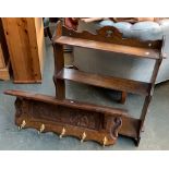 A carved oak shelf bracket with five coat hooks, 84cmW; together with a set of oak hanging