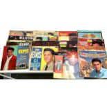 A vinyl case of 17 Elvis Presley albums covering much of his career, together with an RCA Victor