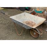 A galvanised wheelbarrow