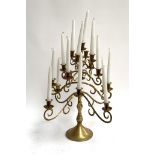 A 4 tier 17 arm brass candelabra with candles, 52cmH