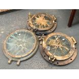 Three brass extremely heavy portholes, possibly recovered by a diver, two opening, each 46cmD