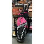 A set of left handed golf clubs, steel callaway, in pink golf bag