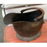 A copper helmet form coal scuttle