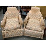 A small pair of armchairs, with unusual shaped backs, 63cmW