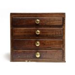 A 19th century mahogany apprentice piece specimen chest of four drawers with subdivisions, with