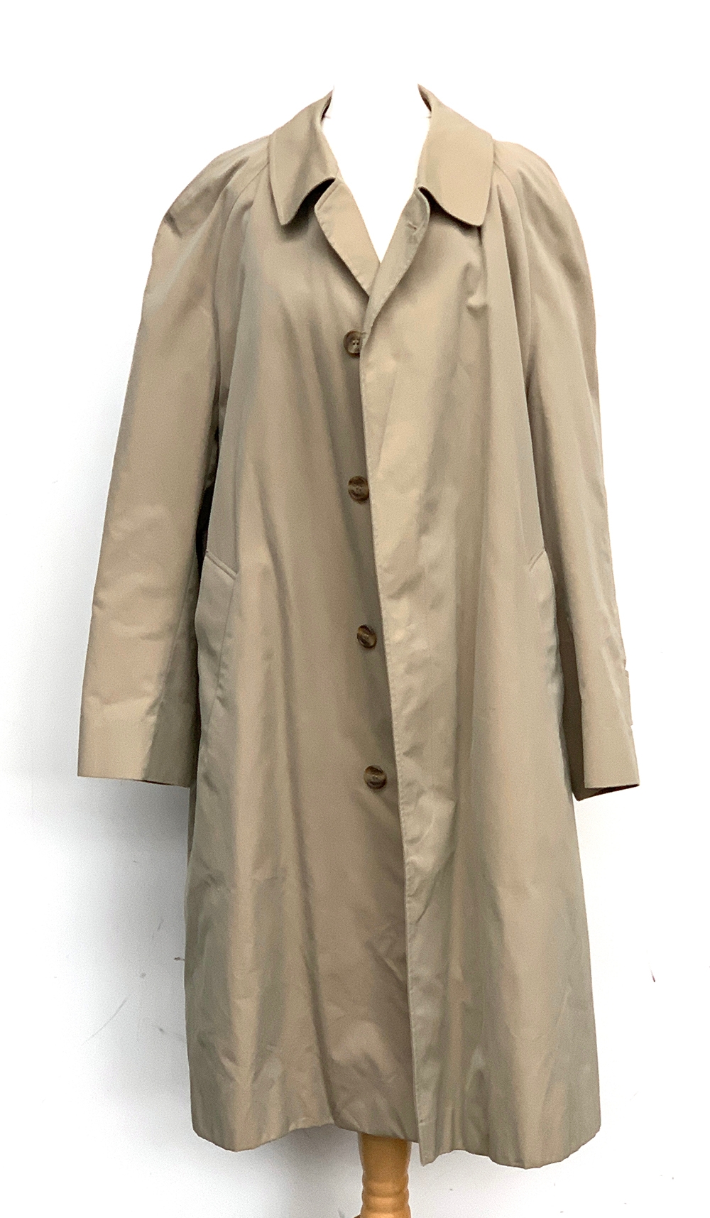An Aquascutum rain mackintosh with cheque lining and further removeable wool lining, new without