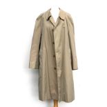 An Aquascutum rain mackintosh with cheque lining and further removeable wool lining, new without