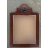 A mahogany framed dressing mirror with urn decoration and beveled glass 50x76cmH