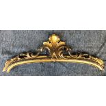 A gilt gesso crest, originally the top of an over mantel mirror, 110cmW; together with a carved