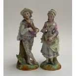 A pair of continental porcelain figures of a gentleman playing the pipes, and a woman (af), each