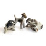 A lot of three Royal Copenhagen dog figures 'Wirehaired Terrier' 3170, and nos. 453 and 131 (3)