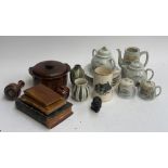 An Oriental part tea service, comprising teapot, milk jug, saucers etc; together with three pieces