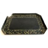 A 19th century black lacquered papier mache tray with floral gilt, 68x47cm, together with an oak