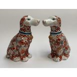 A pair of 20th century Chinese imari pattern dogs, each 31cmH, marked to base