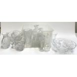 A mixed lot of glass ware to include several cut glass fruit bowls, vases, cut glass jug etc