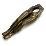 A late Victorian novelty brass nutcracker in the form of a pair of ladies legs, 12cmL