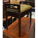 A mahogany piano stool with hinged upholstered seat, 49.5cmW