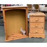 A pine bedside cabinet of three drawers, 46x35x67cmH; together with a small pine bookshelf of two