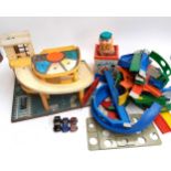 A Fisher Price car garage, together with a jack in the box and a quantity of loop the loop track and