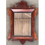 A Regency mahogany mirror with ebonised moulded inset and original plate, 57cmH