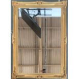 A modern gilt framed rectangular wall mirror with bevelled glass, 105x74cm