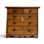 A small 19th century mahogany apprentice piece chest of two short over three long drawers, turned